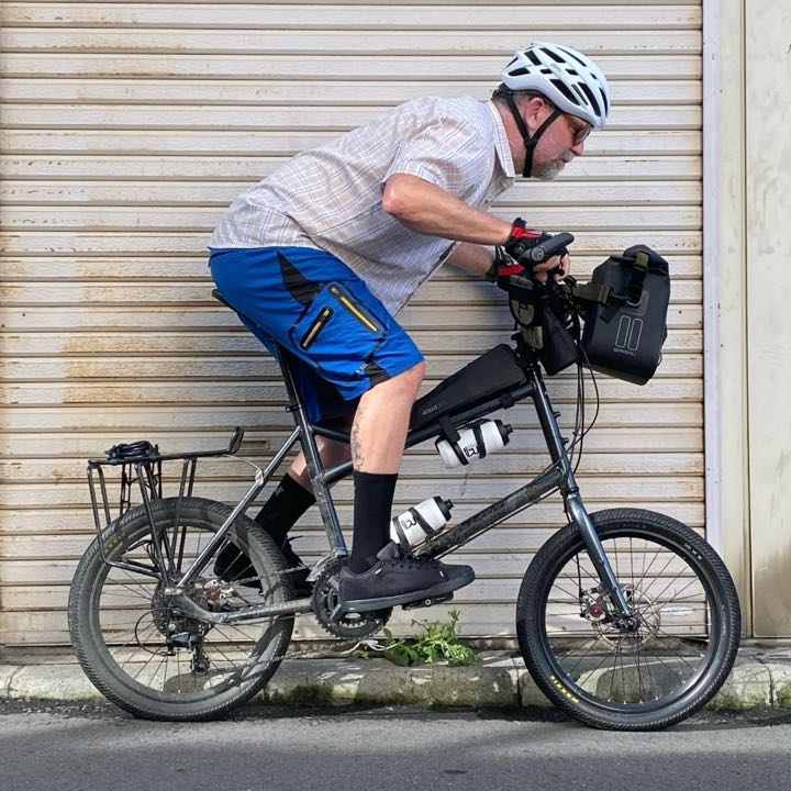 Declan tucked low over the bars, side-on, with pose bones drawn over him.